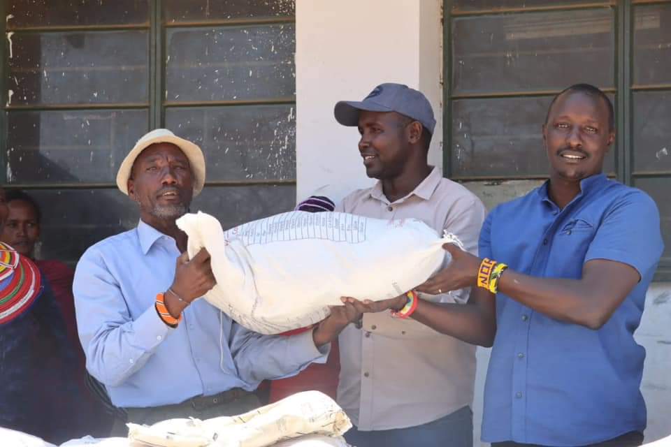 Samburu North Mp Hon. Eli Letapila distributes nutrition foods to Pupils