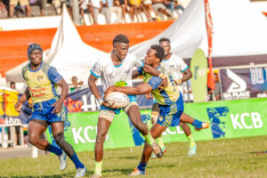 A player from Menengai Oilers confronts Kabras RFC's Jackson Siketa during active play