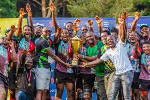 Kenya Harlequins celebrate togther with SportPesa Partnerships Manager, Willis Ojwang, after winning Ingo 7s.