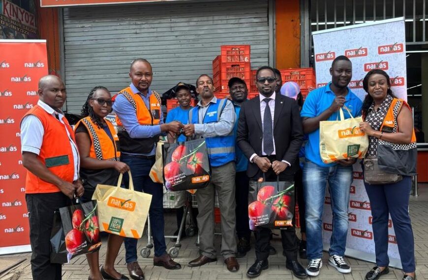 Naivas Supermarket Management team and customers posing for a photo